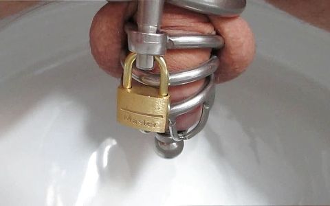 Old Clip from 2017: Pissing through the Plug of Chastity Cage