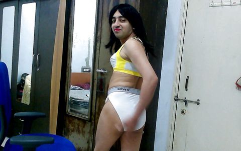 Dirty sissy crossdresser femboy Sweet Lollipop in a sports bra and thong.