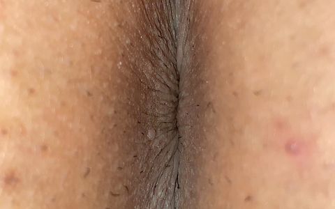 A man exposes his asshole Take a close-up shot so you can see the wrinkles clearly