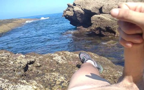 Jerking off a Big Hard Dick Overlooking the Sea in the Cove until he Cums