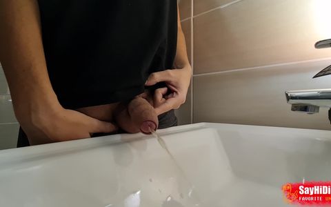 Boy pissing in the sink