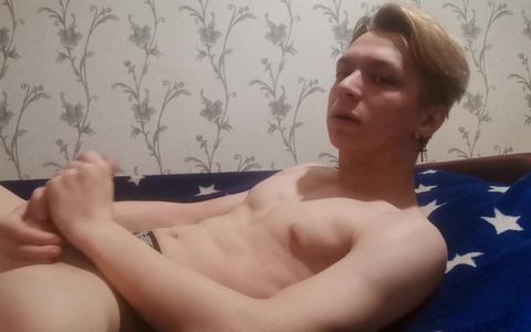 Twink plays with hard cock