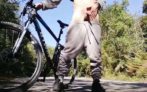 Young man playing with his bike with dildo in his ass