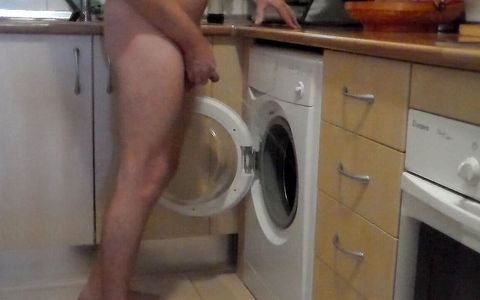 John is peeing all into the washing machine