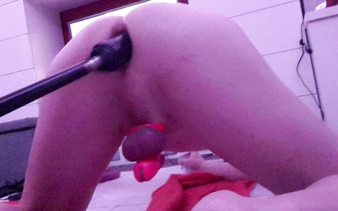 Anal training with 10 inch big black dildo on the fucking machine whilst in chastity