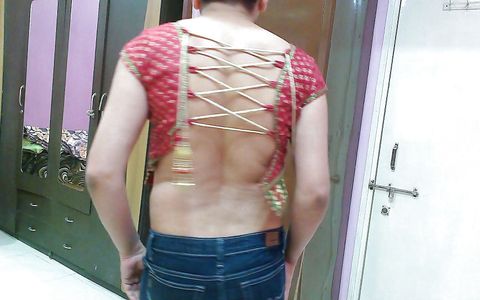 Sexy sissy crossdresser femboy Sweet Lollipop in a top and skinny denim.
