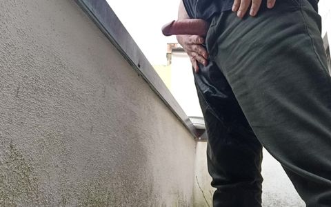 Peeing on the Balcony While Watching People Outside