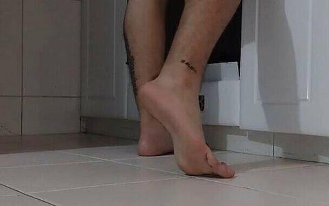 Latino Shows His Feet While Cooking